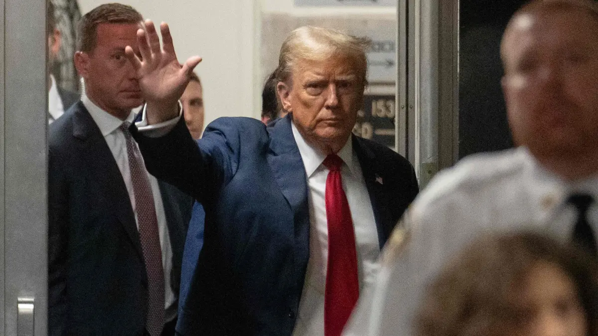 Former US President Donald Trump returns after a break in his trial for allegedly covering up hush money payments linked to extramarital affairs, at Manhattan Criminal Court in New York City, on May 16, 2024. Trump's defense team Thursday continues the questioning of Michael Cohen, the key witness in the criminal trial of the former president (Photo by JEENAH MOON / POOL / AFP)