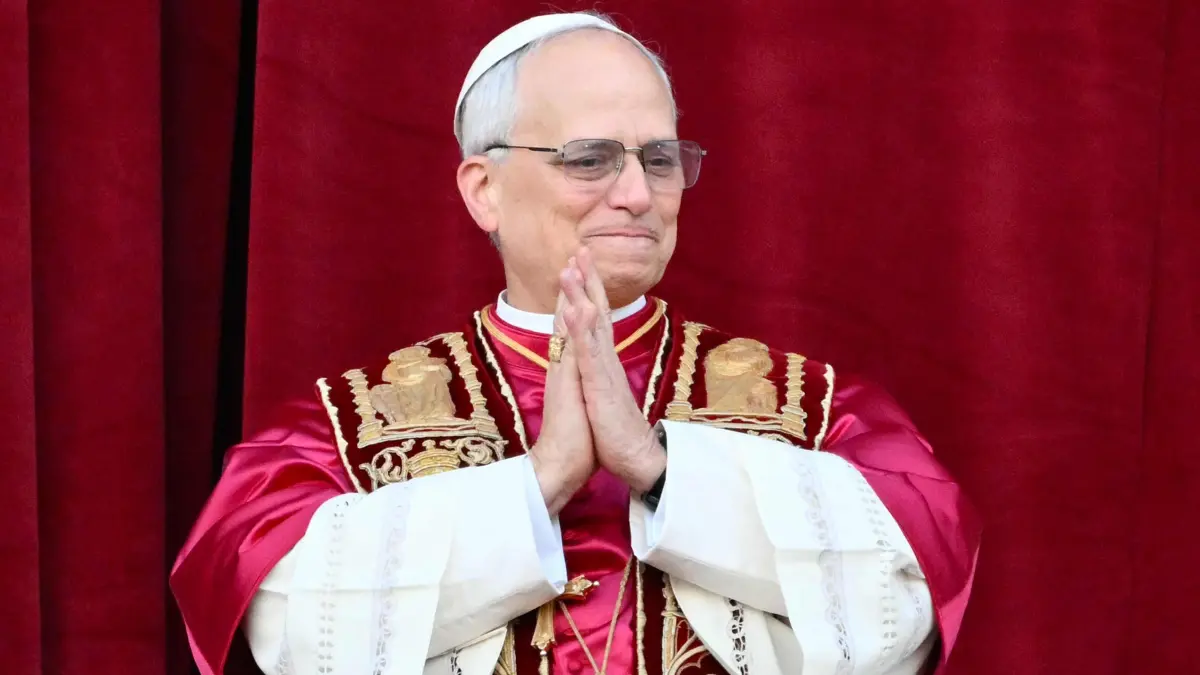 Newly elected Pope Leo XIV, Robert Prevost arrives on the main central loggia balcony of the St Peter's Basilica for the first time, after the cardinals ended the conclave, in The Vatican, on May 8, 2025. Robert Francis Prevost was on Thursday elected the first pope from the United States, the Vatican announced. A moderate who was close to Pope Francis and spent years as a missionary in Peru, he becomes the Catholic Church's 267th pontiff, taking the papal name Leo XIV. (Photo by Alberto PIZZOLI / AFP)