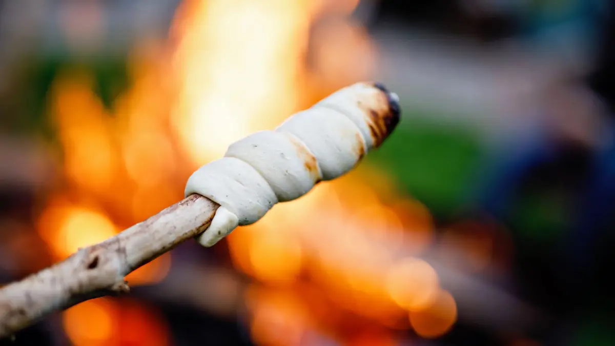 Stick bread twisted on skewer or stick, roasted on flame of fire. Popular party and camp barbecue food in Germany called Stockbrot. Fun for children. Healthy snack. xkwx stick,bread,stockbrot,flame,barbecue,fire,camp,roasted,party,appetiser,fun,wrapped,food,outdoor,activities,snack,roast,grill,flames,rustic,twist bread,bonfire,coal,skewers,glowing,heat,hot,fireplace,baking,wood,campfire,dough,smoke,adventure,stock bread,holiday,children,grilled,coals,over,fieriness,embers,eating,yeast,grilling,fumes,charcoal,skewered,barbeque,delicious