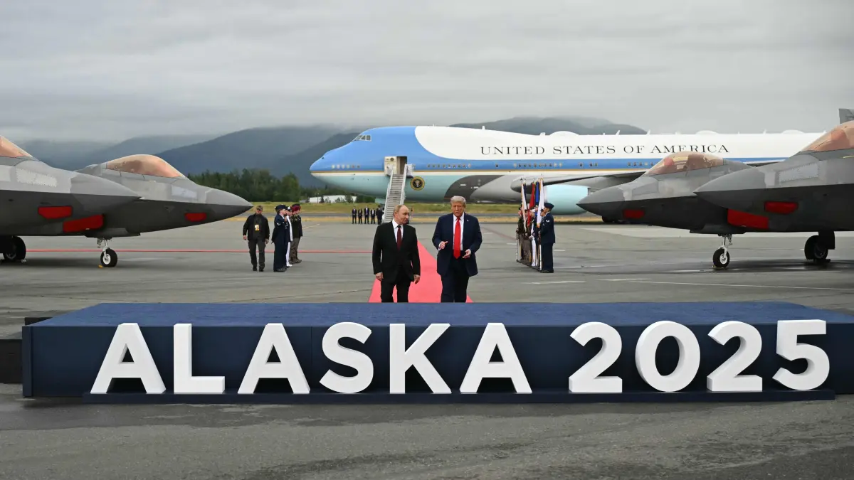 US President Donald Trump greets Russian President Vladimir Putin on the tarmac after they arrived at Joint Base Elmendorf-Richardson in Anchorage, Alaska, on August 15, 2025. Putin is in Alaska at the invitation of Trump in his first visit to a Western country since he ordered the 2022 invasion of Ukraine that has killed tens of thousands of people. (Photo by ANDREW CABALLERO-REYNOLDS / AFP)