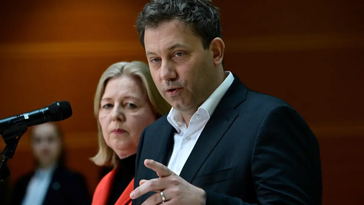 Germany's social democratic SPD party's co-leaders Baerbel Bas (L) and Lars Klingbeil give a statement at their party's headquarters in Berlin on March 23, 2026, one day after state elections in the southwestern state of Rhineland-Palatinate. German Chancellor Friedrich Merz's conservative CDU party ousted the centre-left Social Democratic Party in the closely watched state election in which the far right also made big gains, according to exit polls. (Photo by Tobias SCHWARZ / AFP)
