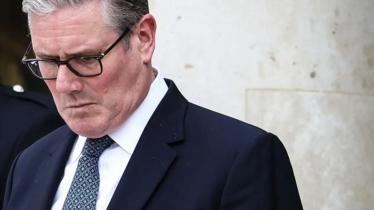 (FILES) Britain's Prime Minister Keir Starmer reacts as he prepares to leave the Elysee Presidential Palace in Paris on April 17, 2026. British Prime Minister Keir Starmer promised on May 9, 2026, he would "listen to voters" after his Labour party received a historic drubbing in local and regional elections. (Photo by Tom Nicholson / POOL / AFP)