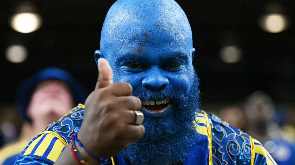 A Curacao supporter poses prior to the 2026 World Cup Group E football match between Germany and Curacao at the Houston Stadium in Houston on June 14, 2026. (Photo by RONALDO SCHEMIDT / AFP)