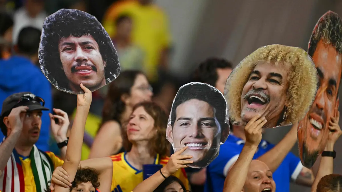 FBL-WC-2026-MATCH24-UZB-COL: Colombian fans show cardboard cutouts depicting Colombia's former footballer Rene Higuita, midfielder James Rodriguez, former footballer Carlos Valderrama, and forward Luis Diaz during the 2026 World Cup Group K football match between Uzbekistan and Colombia at the Mexico City Stadium in Mexico City on June 17, 2026. (Photo by Yuri CORTEZ / AFP)