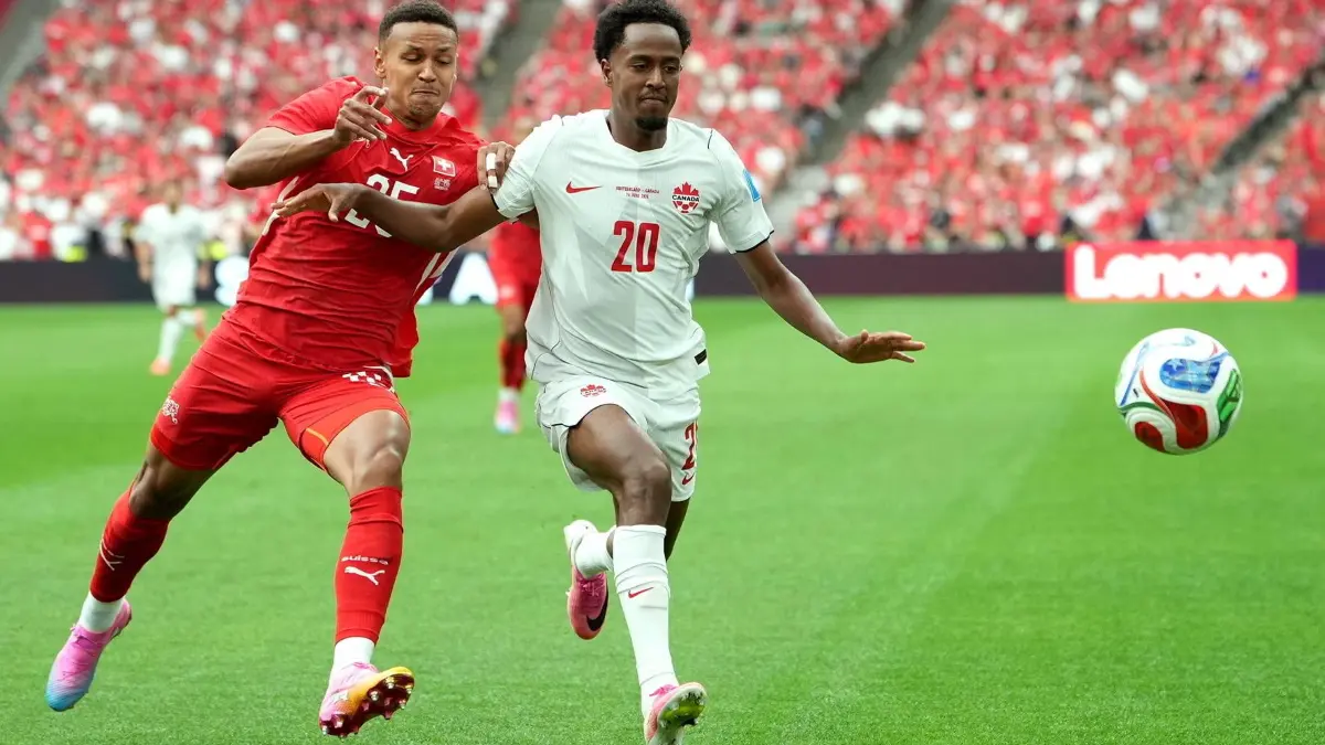 FIFA World Cup 2026 - Group B - Switzerland vs Canada: FIFA World Cup, WM, Weltmeisterschaft, Fussball 2026 - Group B - Switzerland vs Canada Luca Jaquez of Switzerland L in action against Ali Ahmed of Canada during the FIFA World Cup 2026 group stage match Switzerland against Canada, in Vancouver, Canada, 24 June 2026. VANCOUVER Canada PUBLICATIONxINxGERxAUTxINDxONLY Copyright: xBOBxFRIDx