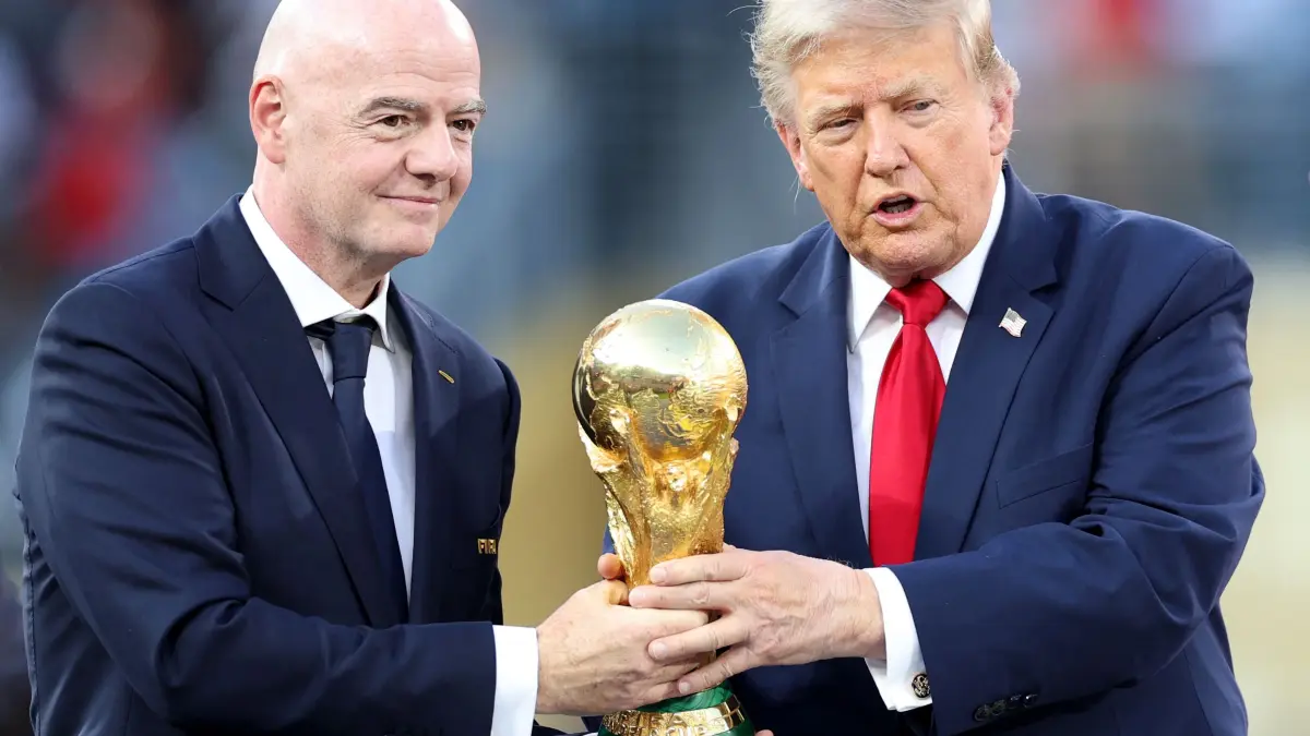 Spain v Argentina: Final - FIFA World Cup 2026: EAST RUTHERFORD, NEW JERSEY - JULY 19: U.S. President Donald Trump and FIFA President Gianni Infantino hold the FIFA World Cup Winner's Trophy before handing over to captain Rodri #16 of Spain at the award ceremony following the FIFA World Cup 2026 Final match between Spain and Argentina at New York New Jersey Stadium on July 19, 2026 in East Rutherford, New Jersey. Dan Mullan/Getty Images/AFP (Photo by Dan Mullan / GETTY IMAGES NORTH AMERICA / Getty Images via AFP)