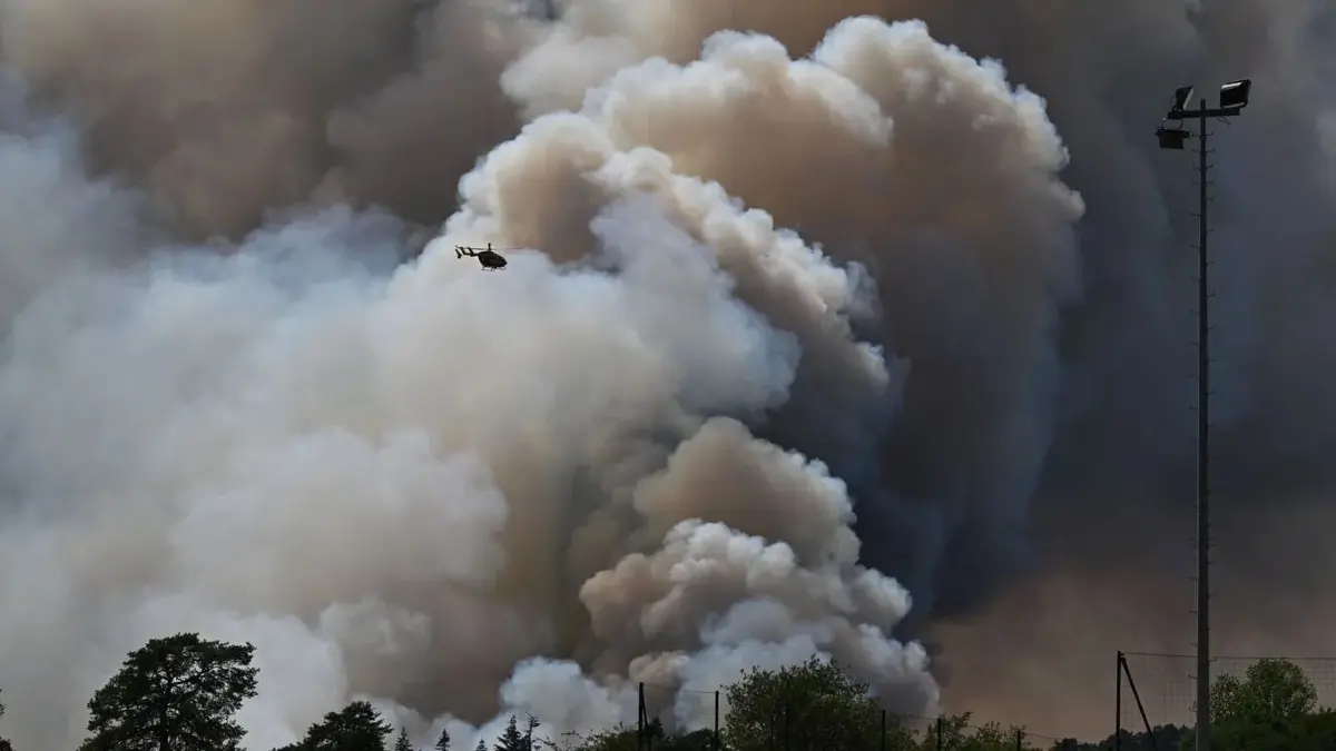 FILE - A pyrocumulonimbus, a giant cloud created by a large wildfire is seen in the Fontainebleau forest region, about 60 kilometers (37 miles) south of Paris, France, Monday, July 13, 2026. (AP Photo/Emma Da Silva, File)