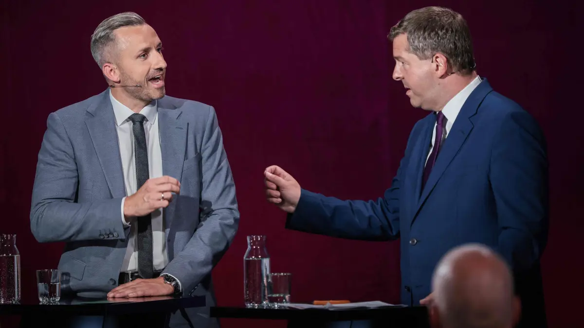 GERMANY-POLITICS-PARTIES-VOTE-ELECTION: AfD's main candidate in the Saxony-Anhalt state election Ulrich Siegmund and Saxony-Anhalt's State Premier and Christian Democratic Union's (CDU) main candidate in the Saxony-Anhalt state election Sven Schulze attend a debate on MDR regional TV in the Broadcasting Center Saxony-Anhalt in Magdeburg, on August 12, 2026, for the upcoming state elections. Saxony-Anhalt will go to the polls in the regional elections on September 6, 2026. (Photo by Ronny HARTMANN / AFP)