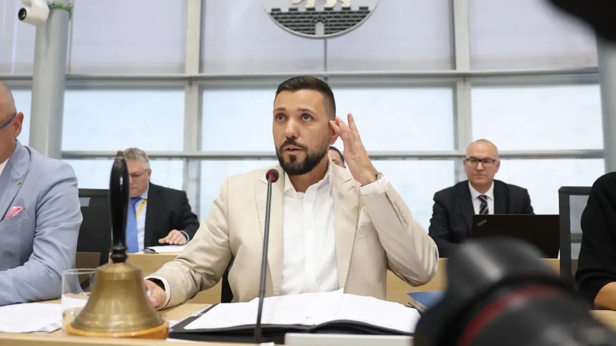 GERMANY-POLITICS-VOTE-STATE-PARLIAMENT: Newly elected state parliament president Tobias Rausch of the far-right Alternative for Germany (AfD) party sits at the lectern after his election during the first constituent session of the state parliament of Saxony-Anhalt in Magdeburg, eastern Germany, on October 6, 2026. Newly elected state lawmakers gather for the first time in the parliament building in the state capital Magdeburg to elect a speaker, with a candidate of the far-right Alternative for Germany (AfD) expected to win. The AfD is poised to preside over a state assembly for the first time following its landslide election victory in the eastern state of Saxony-Anhalt. The AfD took nearly 44 percent of the vote in the September 2026 state election. (Photo by Jan Woitas / POOL / AFP)