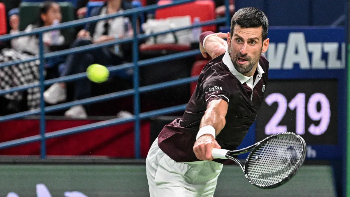 TENNIS-ATP-CHN: Serbia's Novak Djokovic hits a return to Poland's Hubert Hurkacz during their men's singles match at the Shanghai Masters tennis tournament in Shanghai on October 9, 2026. (Photo by Hector RETAMAL / AFP)