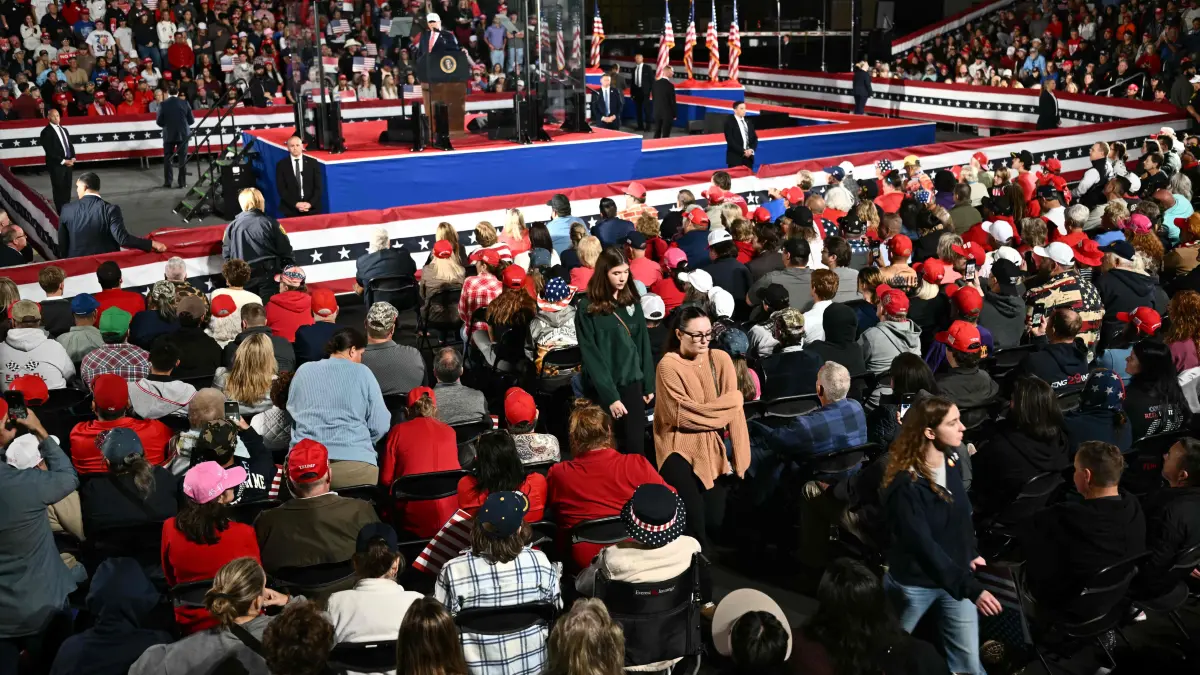 US-POLITICS-TRUMP: Attendees leave early as US President Donald Trump speaks at a midterm campaign rally at Pitt-Greenville Airport in Greenville, North Carolina, on October 20, 2026. (Photo by Kent NISHIMURA / AFP)