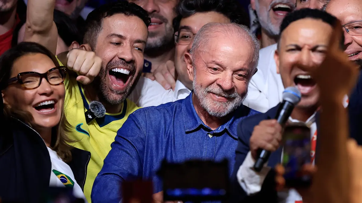 BRAZIL-ELECTION-RUNOFF-VOTE: Brazil's President and re-election candidate for the Workers' Party (PT) Luiz Inacio Lula da Silva reacts after knowing the first results of the presidential runoff election, in Sao Paulo, Brazil, on October 25, 2026. Lula da Silva pulled off a dramatic comeback on October 25, 2026, as he clinched election victory against right-wing senator Flavio Bolsonaro, who trounced him in the first round. (Photo by Miguel SCHINCARIOL / AFP)